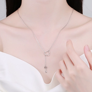 Elegant silver heart and key Y-necklace for women with adjustable chain on model