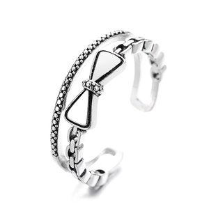 Bague double couche nœud papillon vintage argenté avec chaîne et ouverture réglable