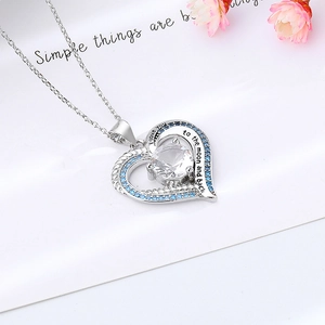 Silver heart necklace with blue zircon and I love you to the moon and back engraving