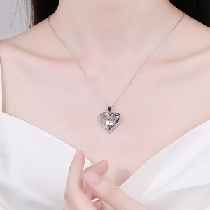 Elegant silver heart necklace featuring blue crystals and a clear zircon on a delicate chain