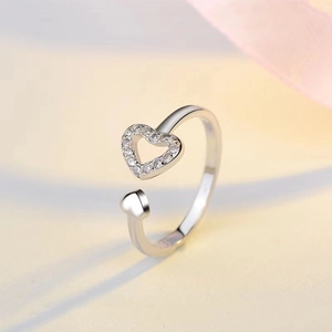Elegant silver open heart ring featuring hollow cubic zirconia and a solid small heart