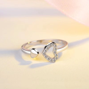 Chic silver open ring featuring an asymmetric hollow heart with sparkling cubic zirconia