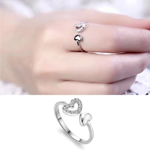 Close-up of double heart open ring with sparkling zircon pavé and silver finish