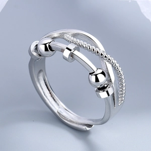 Polished silver fidget ring with three moving beads and cross band design