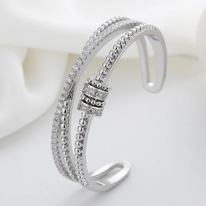 Adjustable multi-layer silver bangle featuring rotating zircon bead and sparkling stones