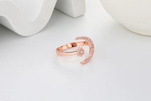 Close-up of S925 engraved crescent moon and star ring with sparkling crystals