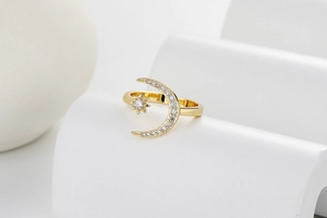 Macro detail of crescent moon and star ring with S925 engraving on inner band