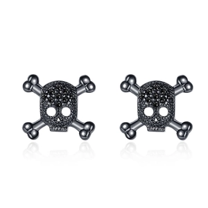 Gothic punk skull and crossbones stud earrings with black crystals on white background