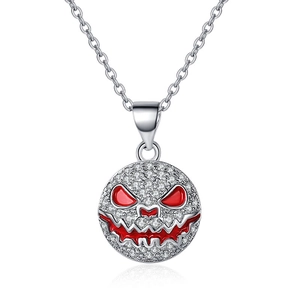 Detail of Halloween pumpkin pendant with white zircons and red enamel inlay work
