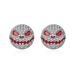 Detail of silver stud earrings with white zircons and red enamel pumpkin face