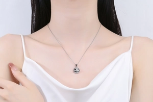 Macro view of silver necklace featuring a sparkling iced-out Jack Skellington skull pendant