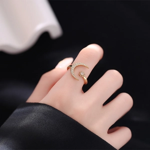 Chic gold crescent moon and star open ring with sparkling cubic zirconia on a hand