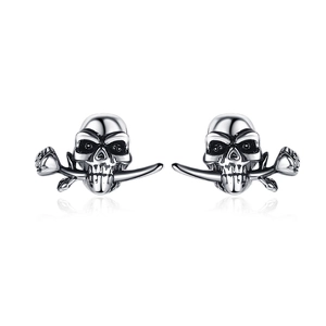 Vintage style skull biting rose earrings in oxidized silver finish on white background