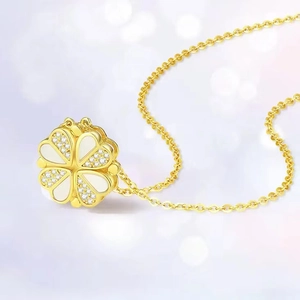 Golden clover necklace with white shell inlay and sparkling crystals on O-chain