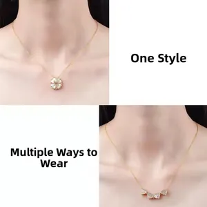 Macro detail of convertible four-leaf clover necklace with white shell and gold chain