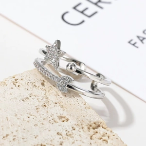Double layered star and moon ring with cubic zirconia in adjustable silver band