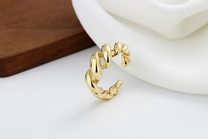 Detailed view of the twisted rope texture on this gold-plated adjustable open ring