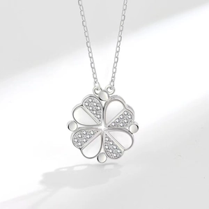 Silver four-leaf clover necklace with magnetic hearts and shimmering white shell inlay