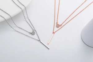 Detail of double-layer necklace with micro-pave zircon pendant and Y-shaped long bar drop