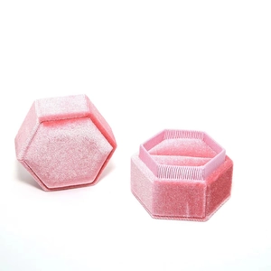Pink velvet hexagonal jewelry box with double ring slots and textured lid for gifting