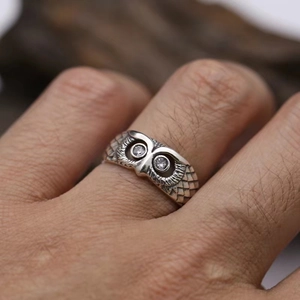 Vintage owl open ring with white gemstone eyes and detailed feather texture in punk style