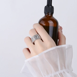 Hip hop silver ring with micro-paved zircons and retro embossed patterns on finger