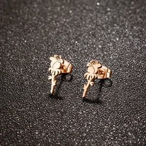Elegant rose gold flower stud earrings with detailed petal and thorn design on black background