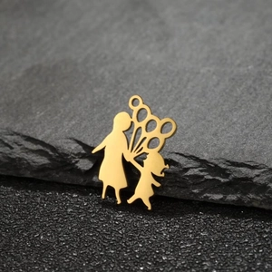Golden mother and child cutout pendant made of stainless steel on dark stone background