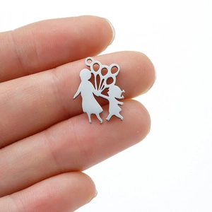 Detailed view of a stainless steel mother and daughter silhouette pendant with balloons