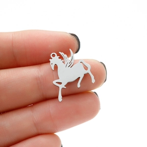 Macro detail of polished stainless steel Pegasus charm pendant for DIY jewelry design