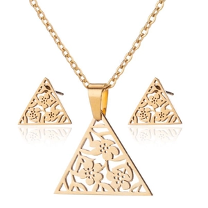 Macro detail of gold-plated stainless steel jewelry set with laser-cut floral triangles