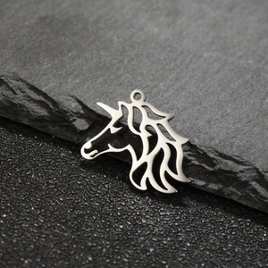 Macro detail of silver unicorn animal pendant with matte finish for DIY jewelry