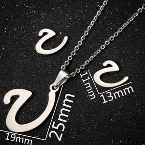 Stainless steel jewelry set featuring capital letter U pendant and matching stud earrings
