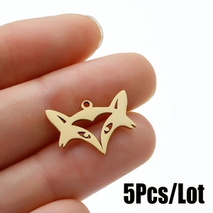 Close-up of mini gold fox head pendants with heart cutout, shown as 5pcs per lot