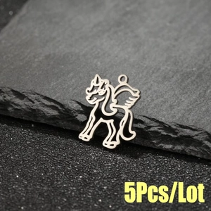 Detailed close-up of 5pcs silver hollow Pegasus charms on dark stone for jewelry DIY