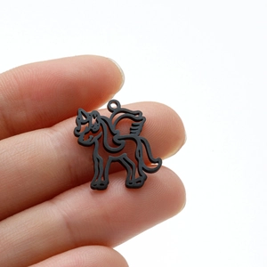 Macro view of matte black stainless steel unicorn charm for DIY jewelry making