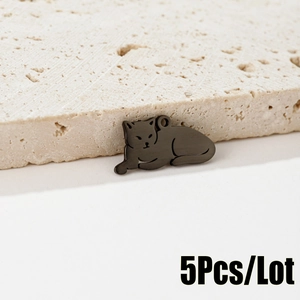 Detailed macro view of gunmetal leopard pendant with brushed finish texture
