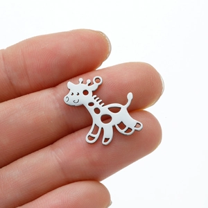 Detailed view of a polished silver giraffe pendant with hollow dots and top loop