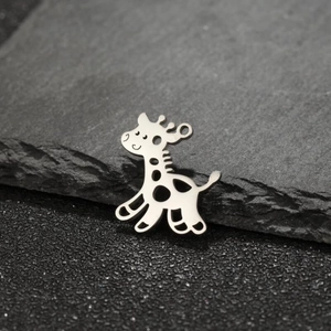 Polished stainless steel giraffe pendant with hollow-out pattern on dark rock background