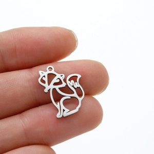 Macro shot of silver fox origami pendant showing fine brushed stainless steel texture