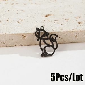 Detailed view of 5-piece set of black origami fox pendants on natural stone surface