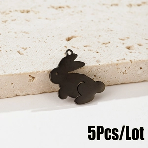 Close-up of five matte black rabbit-shaped metal charms for DIY jewelry making