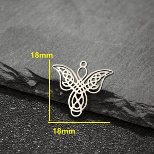 Polished stainless steel 18mm angel pendant with Celtic knot design on grey stone