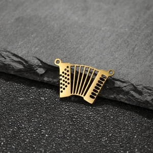 Macro shot of accordion pendant in gold-plated stainless steel for DIY jewelry
