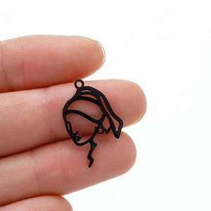 Detail of Girl with a Pearl Earring silhouette charm in black cutout metal finish