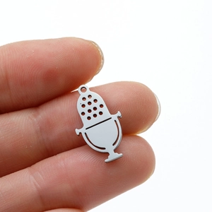 Vintage stainless steel microphone pendant charm for DIY jewelry being held by hand