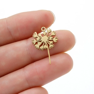 Golden stainless steel dandelion pendant charm for DIY jewelry held for size scale