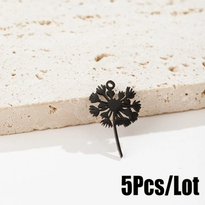 Detailed view of 5-piece black dandelion flower charms for DIY jewelry making