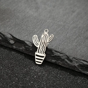 Detail of silver stainless steel hollow cactus charms for DIY jewelry making