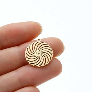 Detailed view of a golden stainless steel spiral vortex flower charm pendant for DIY jewelry